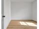 An empty bedroom featuring wood-look floors and white walls at 3085 Jackson St, Hapeville, GA 30354
