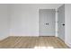 Clean bedroom featuring hardwood floors and a closet with sliding doors at 3085 Jackson St, Hapeville, GA 30354