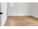 Simple bedroom featuring hardwood floors and minimal design elements at 3085 Jackson St, Hapeville, GA 30354