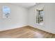 Bedroom featuring natural light, clean white walls, with neutral trim and matching wood-look floors at 3085 Jackson St, Hapeville, GA 30354