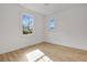 Bright bedroom with hardwood floors and two large windows offering natural light at 3085 Jackson St, Hapeville, GA 30354