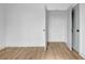 Bedroom featuring hardwood floors, a closet with open doors and shelving at 3085 Jackson St, Hapeville, GA 30354