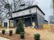 Side view of a newly constructed home with a 'For Sale' sign and a freshly landscaped yard at 3085 Jackson St, Hapeville, GA 30354