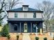 Charming two-story home featuring a welcoming front porch and a freshly landscaped front yard at 3085 Jackson St, Hapeville, GA 30354