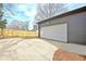 View of the detached garage and its ample driveway and backyard space at 3085 Jackson St, Hapeville, GA 30354