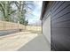 Detached garage with a spacious backyard and concrete driveway and newly constructed fence at 3085 Jackson St, Hapeville, GA 30354