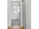 Hallway looking into the bedroom featuring wood-look floors and natural light at 3085 Jackson St, Hapeville, GA 30354