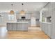 Bright kitchen with light gray cabinetry, stainless steel appliances, and a central island at 3085 Jackson St, Hapeville, GA 30354