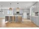 Open kitchen with an island, plenty of cabinets, modern appliances, and hardwood flooring at 3085 Jackson St, Hapeville, GA 30354