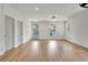 Bright, open living room boasts neutral paint, recessed lights, and attractive wood-look floors throughout at 3085 Jackson St, Hapeville, GA 30354