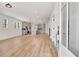 A modern living space featuring an open floor plan, wood floors, and a kitchen view at 3085 Jackson St, Hapeville, GA 30354