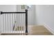 Staircase with white spindles, a dark handrail, and a wood-look flooring at 3085 Jackson St, Hapeville, GA 30354