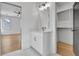 Bathroom view highlighting a vanity, mirror, and walk-in closet; bedroom in background at 3163 Old Jonesboro Rd, Hapeville, GA 30354