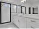 Modern bathroom with white cabinets, marble countertops, and a glass-enclosed shower at 3163 Old Jonesboro Rd, Hapeville, GA 30354