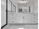 Bathroom featuring double vanity, marble countertops and floor, with glass shower in the background at 3163 Old Jonesboro Rd, Hapeville, GA 30354