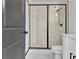 Modern bathroom with a glass-enclosed shower and white vanity at 3163 Old Jonesboro Rd, Hapeville, GA 30354
