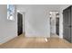 Bedroom with doors leading to en-suite bathroom featuring wood floors at 3163 Old Jonesboro Rd, Hapeville, GA 30354