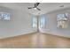 Bright bedroom with hardwood floors, large windows, and modern ceiling fan at 3163 Old Jonesboro Rd, Hapeville, GA 30354