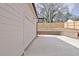 Spacious driveway featuring a two-car garage and a charming brick retaining wall with a wooden fence at 3163 Old Jonesboro Rd, Hapeville, GA 30354