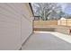 A long driveway extends to the garage with a brick retaining wall and a wood fence at 3163 Old Jonesboro Rd, Hapeville, GA 30354