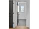 Hallway displaying modern gray doors with contemporary door hardware at 3163 Old Jonesboro Rd, Hapeville, GA 30354