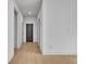Hallway view featuring modern wood flooring and doors at 3163 Old Jonesboro Rd, Hapeville, GA 30354