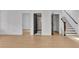 Hallway with open doors to bathroom and closet, and light wood floors at 3163 Old Jonesboro Rd, Hapeville, GA 30354