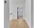 Hallway with hardwood floors and neutral paint at 3163 Old Jonesboro Rd, Hapeville, GA 30354