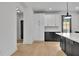 Kitchen featuring white cabinets, dark counters, and island with bar seating at 3163 Old Jonesboro Rd, Hapeville, GA 30354