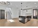 Kitchen island with white countertop, stainless steel dishwasher and wood floors at 3163 Old Jonesboro Rd, Hapeville, GA 30354