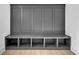 Grey mudroom bench with storage cubbies and wood flooring at 3163 Old Jonesboro Rd, Hapeville, GA 30354