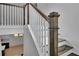 White staircase with wood railings and wood flooring at 3163 Old Jonesboro Rd, Hapeville, GA 30354