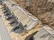 An aerial view of modern townhomes with neutral exteriors and landscaped front yards at 495 Duval Dr, Alpharetta, GA 30009