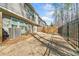 View of backyard, fenced, with patio and air conditioning unit on the side of the house at 495 Duval Dr, Alpharetta, GA 30009
