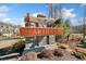 Stone sign for the Artisan community with landscaping and houses in the background at 495 Duval Dr, Alpharetta, GA 30009
