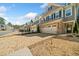 Street view of townhomes with brick driveways, two car garage, and landscaped yards at 495 Duval Dr, Alpharetta, GA 30009