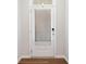 Interior shot of a white front door with blinds and visible deadbolt lock at 495 Duval Dr, Alpharetta, GA 30009
