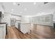 Open concept kitchen and living area with stainless steel appliances and ample natural light at 495 Duval Dr, Alpharetta, GA 30009