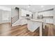 Well-lit kitchen featuring stainless steel appliances, granite countertops, and an island with bar seating at 495 Duval Dr, Alpharetta, GA 30009