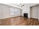 Bright living room featuring a classic fireplace and large windows for natural light at 495 Duval Dr, Alpharetta, GA 30009