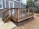 Outdoor living space featuring a wood deck with metal wire railing and wood steps at 6121 Gordy Ne St, Covington, GA 30014