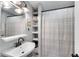 Cozy bathroom features open shelving and a shower with a clean, modern aesthetic at 681 Home Se Ave, Atlanta, GA 30312