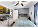 Comfortable bedroom with a ceiling fan, television, and natural light through the window at 681 Home Se Ave, Atlanta, GA 30312