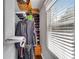 Walk-in closet with custom shelving, hanging racks, and window bringing in natural light at 681 Home Se Ave, Atlanta, GA 30312