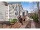 Side exterior view of the house showcasing the entrance porch and driveway at 681 Home Se Ave, Atlanta, GA 30312