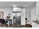 Well-equipped kitchen area with stainless steel refrigerator, plenty of cabinet space, and adjacent workspace at 681 Home Se Ave, Atlanta, GA 30312