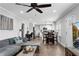 Open-concept layout combining a living area, dining space, and kitchen with hardwood floors and neutral tones at 681 Home Se Ave, Atlanta, GA 30312