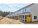 Long row of townhouses showcasing screened-in back porches at 1327 Fern Ridge Ct # 27, Norcross, GA 30093