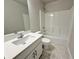 Clean bathroom with a white vanity, quartz countertop, and a bathtub and shower combination at 1327 Fern Ridge Ct # 27, Norcross, GA 30093