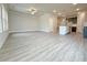 Open concept living space featuring hard surface floors and a seamless transition to the kitchen at 1327 Fern Ridge Ct # 27, Norcross, GA 30093